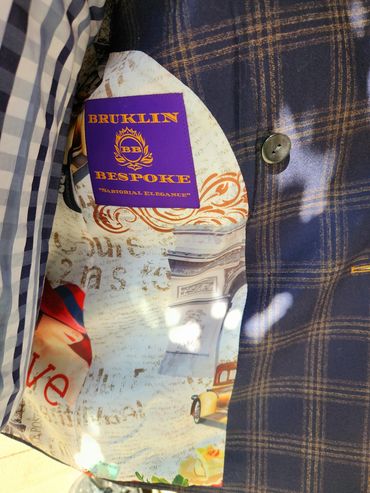 A Bruklin Bespoke statement—tailored checks, bold buttons, signature lining, pure sartorial power.