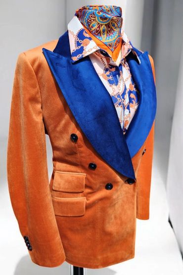 Two-tone velvet woman's suit. Features a 2 inch velvet stripe on pant that matches lapel of jacket. 