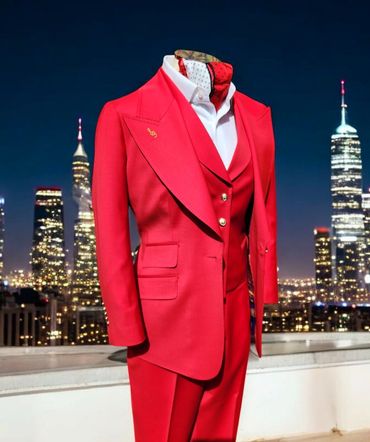 Tailored scarlet three-piece features a sculpted peak lapel, elegant ticket pocket and gold buttons.