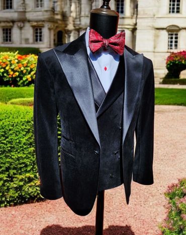 Bespoke three-piece velvet tuxedo with wide satin peak lapels on jacket and vest. 