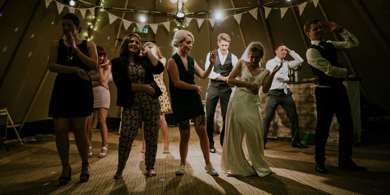 The bride and other people dancing in front