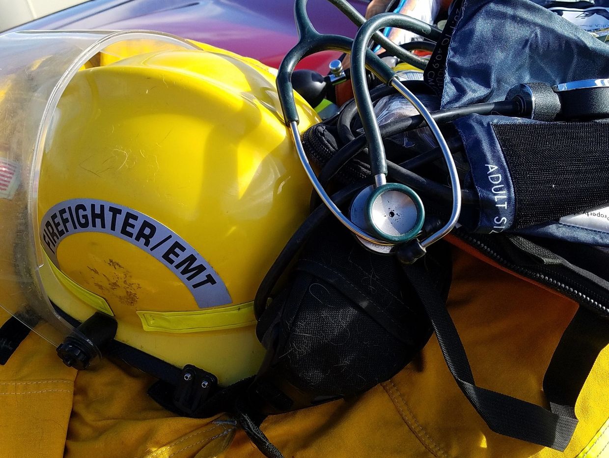 firefighter/emt helmet with emergency equipment