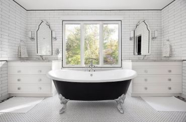 Elegant black and white bathroom with clawfoot tub.