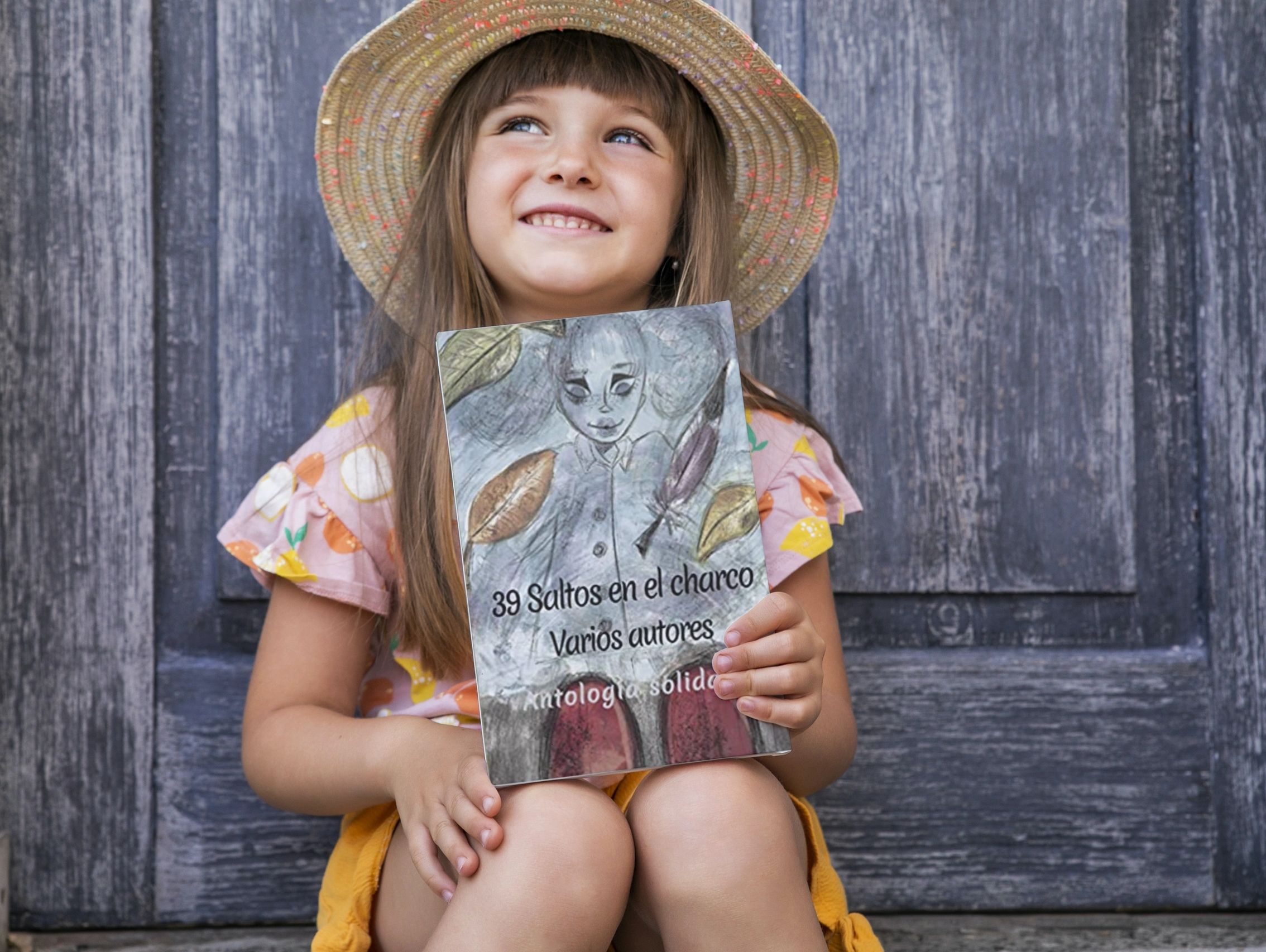 Niña con ejemplar de 39 Saltos en el charco