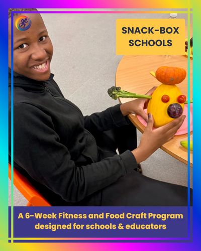 Smiling student holding a colourful vegetable food craft at a classroom table, representing the Snac
