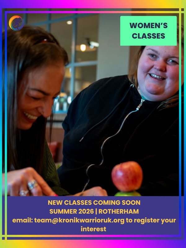 Two women smiling and laughing while preparing fruit together during a Snack Box women’s session, sh