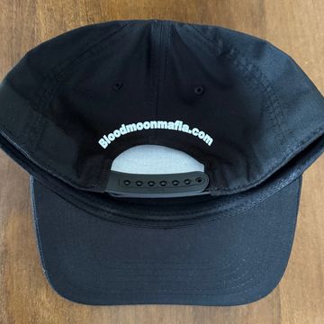 Black cap with "Bloodmoonmafia.com" on the back.