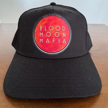 Black baseball cap with a red circle logo.