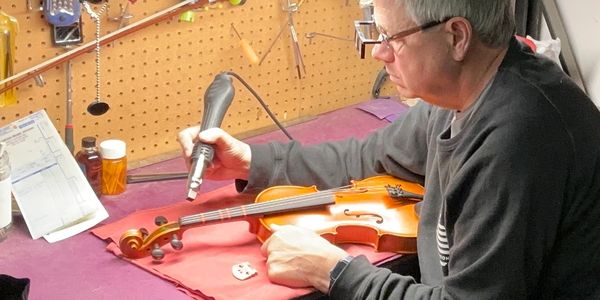 Removing the nut from a violin