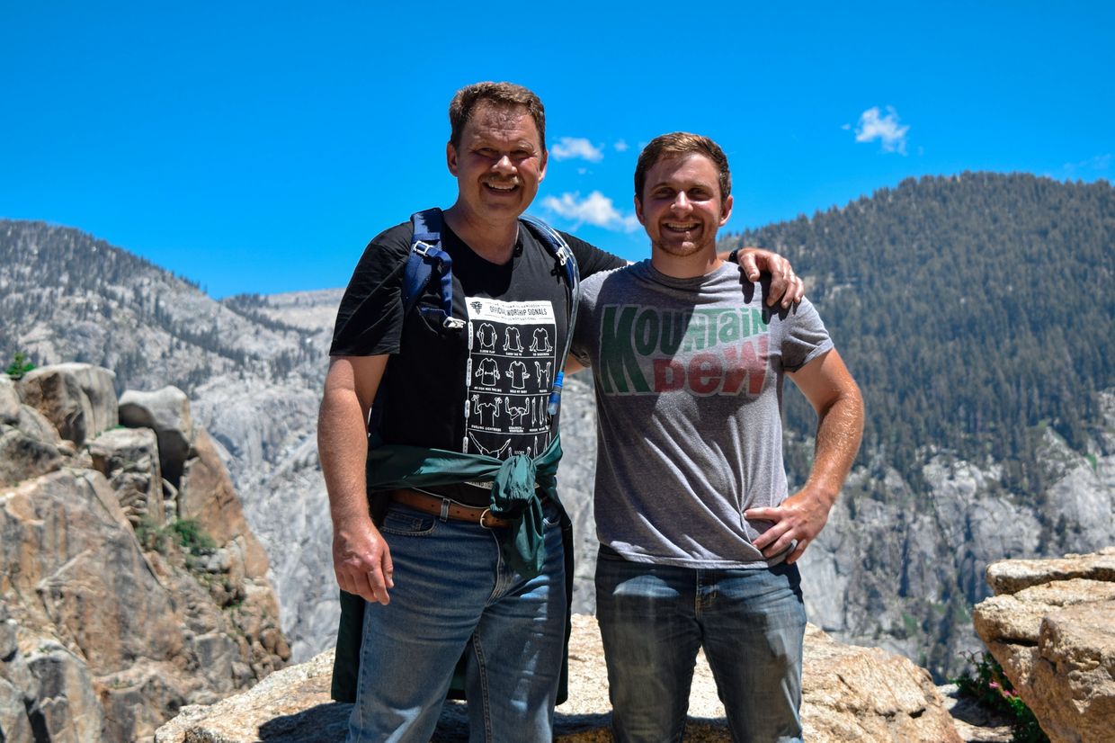 Father and son on a mountain top