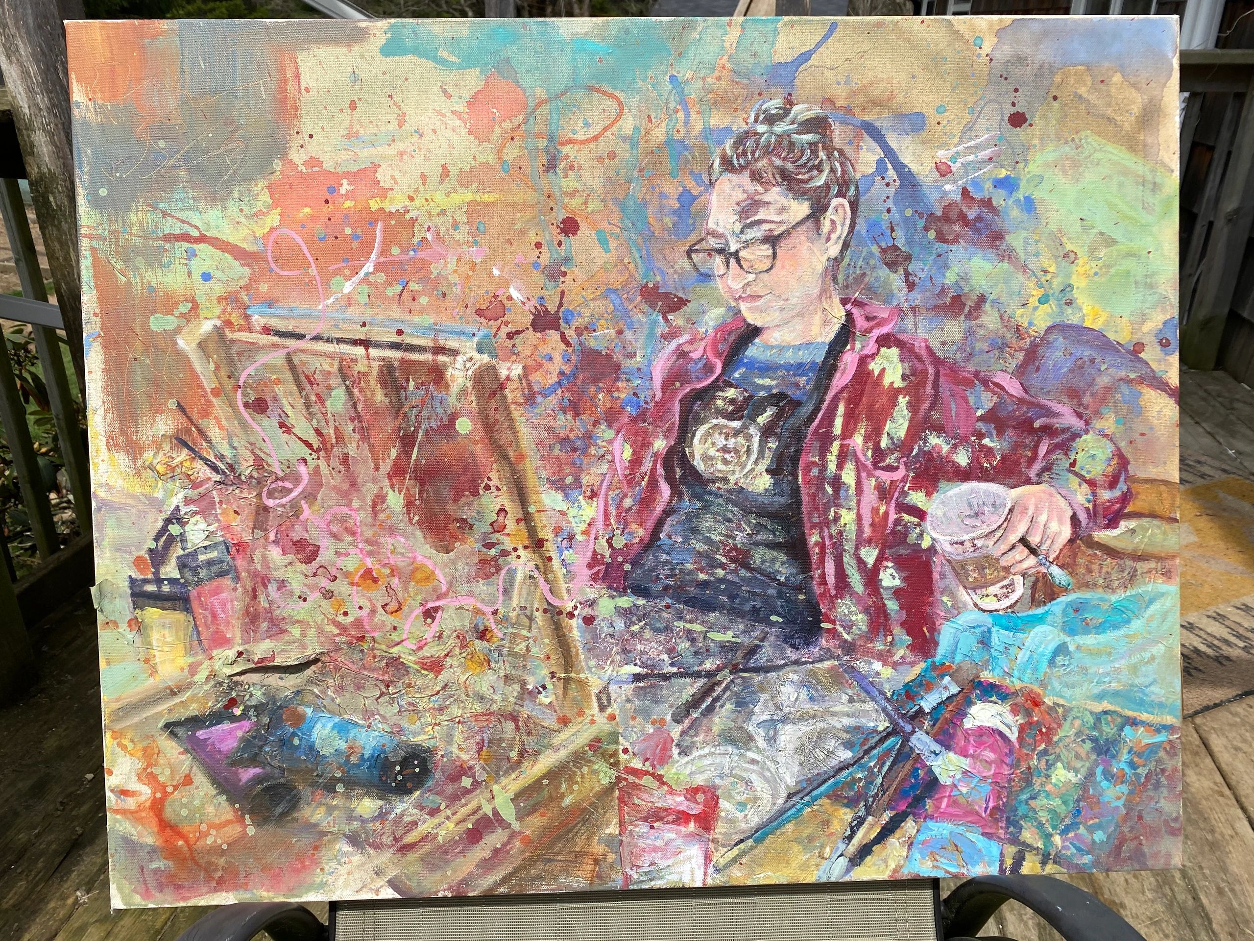 Colorful abstract painting of a person sketching with vibrant splashes.
