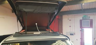 VW Transporter with Westdubs poptop open scenic canvas