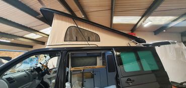 VW Transporter with Westdubs poptop closed scenic canvas