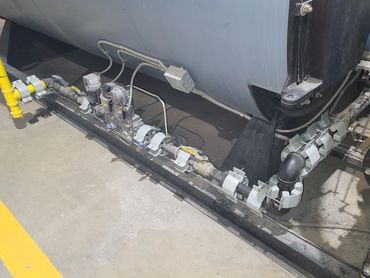 Industrial piping system with valves and sensors.