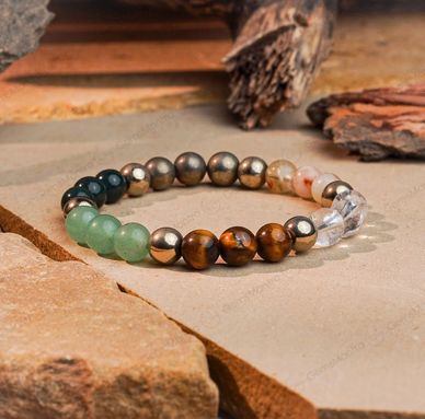 Colorful gemstone beaded bracelet on stone surface.
