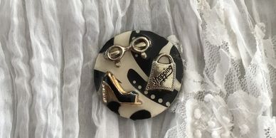 A round, black-and-white key keeper