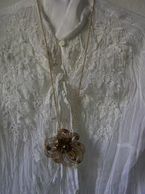 A necklace with a flower pendant