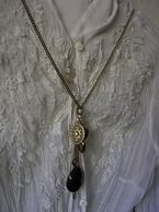 A unique necklace with black and silver pendants