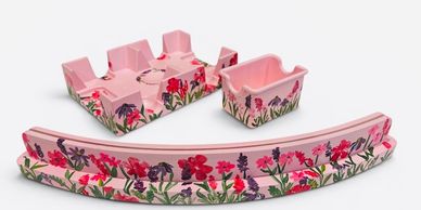 Pink floral ceramic ashtrays and coasters set.