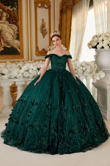 Woman in a luxurious emerald green ball gown with a tiara.
