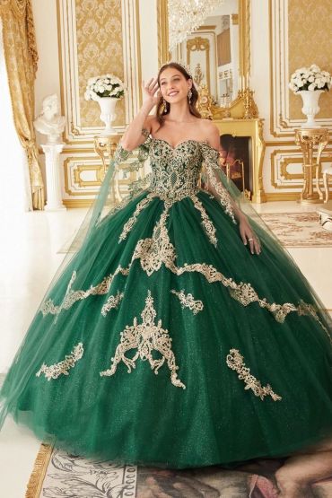 Woman in elegant green ball gown with gold embroidery.