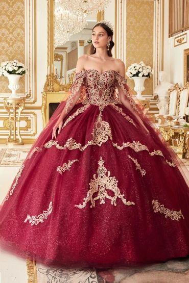 Woman in a luxurious burgundy ball gown.