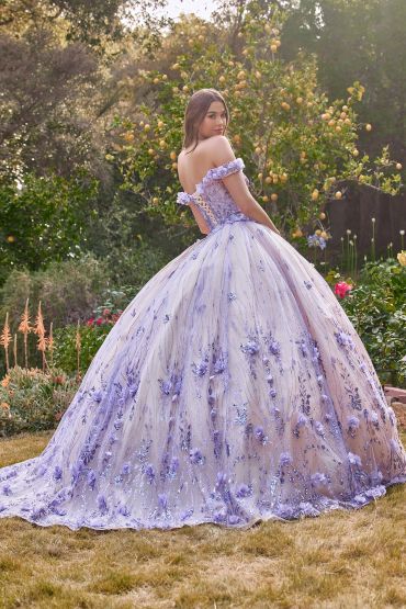 Woman in a lavender ball gown in a garden.