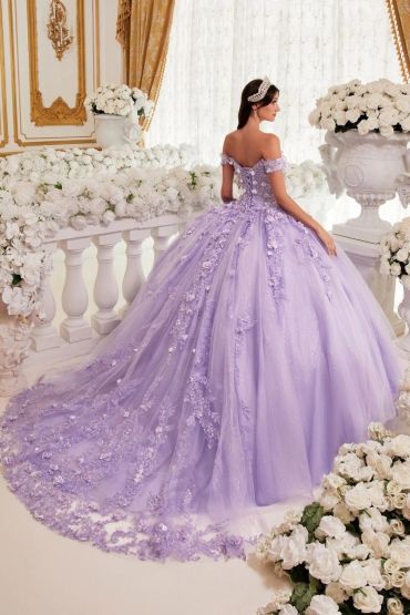 Woman in elegant lavender ball gown with floral details.