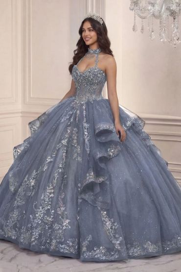 Elegant woman in blue embellished ball gown and tiara.