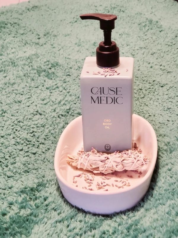 CBD massage oil with lavender flowers and sage bundle