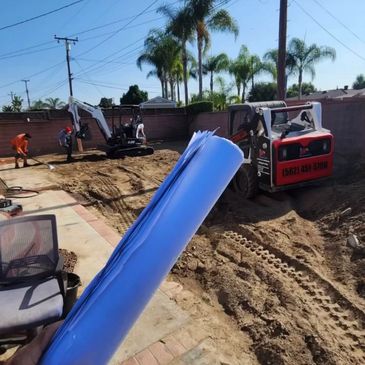 Construction site with equipment and workers.