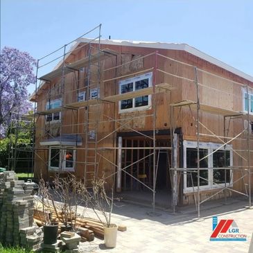 House under construction with scaffolding around it.