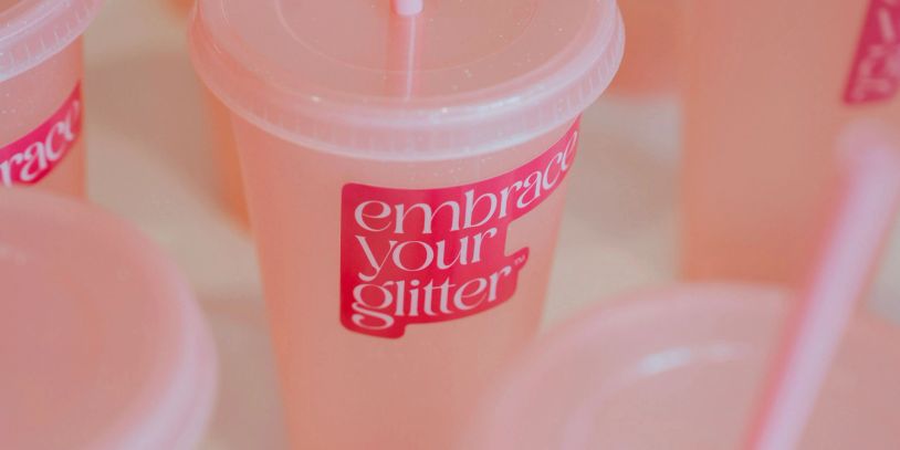 Close-up of a pink cup with a label.