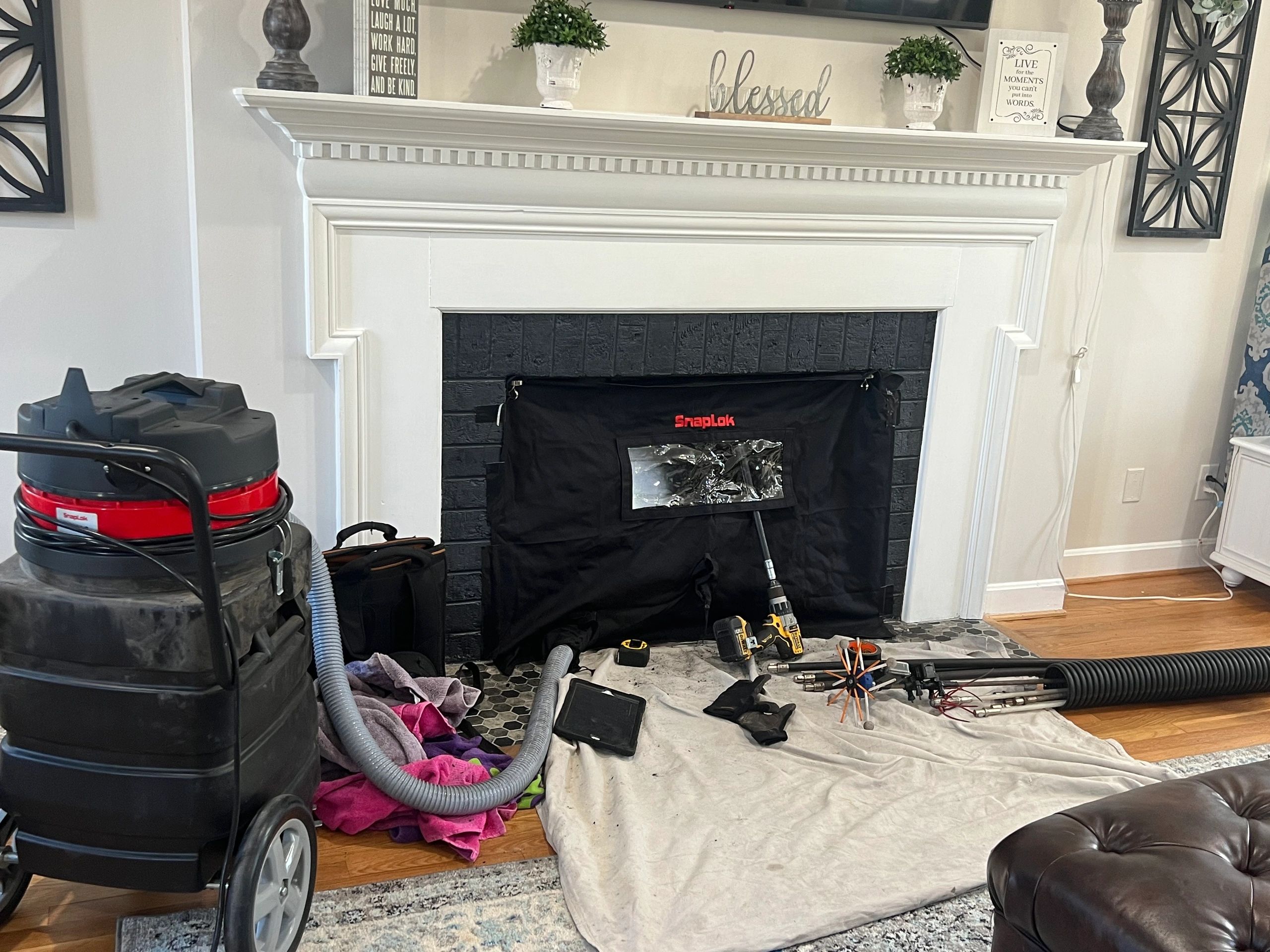 Certified Chimney Sweep Cleaning a Chimney in Harrisonburg, VA (Flue Pros Chimney)
