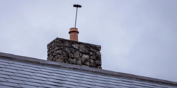 Certified Chimney Sweep Cleaning a Chimney in Harrisonburg, VA (Flue Pros Chimney)