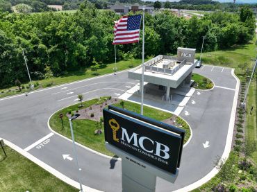 Entrance to MCB with American flag and security booth.