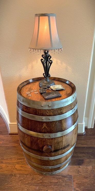 Provincial stained retired whiskey barrel accent table and lamp.