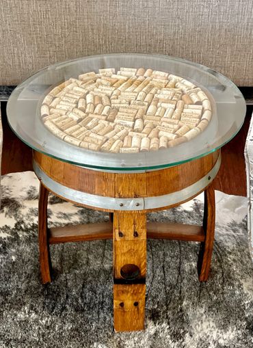 Barrel head side or accent table with wine cork and glass top.