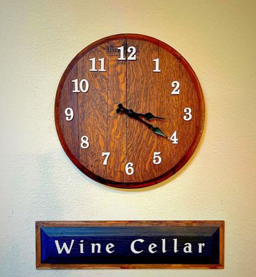 Whiskey barrel head wall clock.