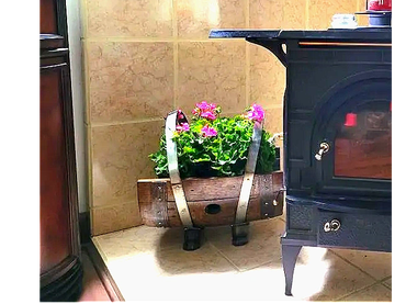 Barrel stave wood holder featuring pink flowers.