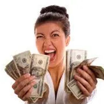 Excited woman holding multiple US dollar bills enthusiastically.