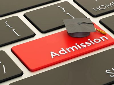 Keyboard key labeled Admission with graduation cap on it.
