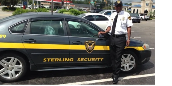 Private Security Guard in Sterling Security vehicle on patrol