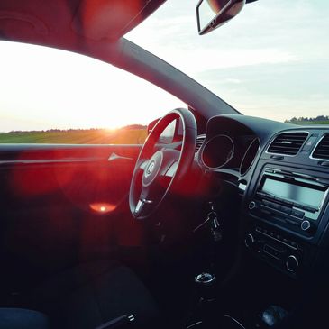 Auto Glass windshield replacement driving into sunset