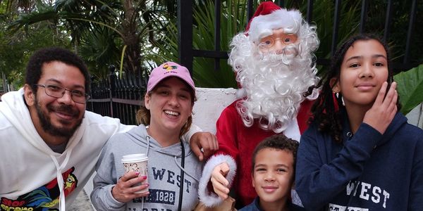 An image of one of the owners of Black and White Renovations with his family on vacation.