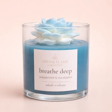 Blue scented candle with a flower-shaped wick, labeled 'breathe deep'.