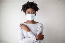 African American woman with a face mask.