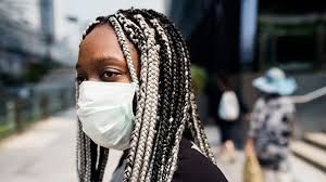 Black Woman in Chicago with a mask.