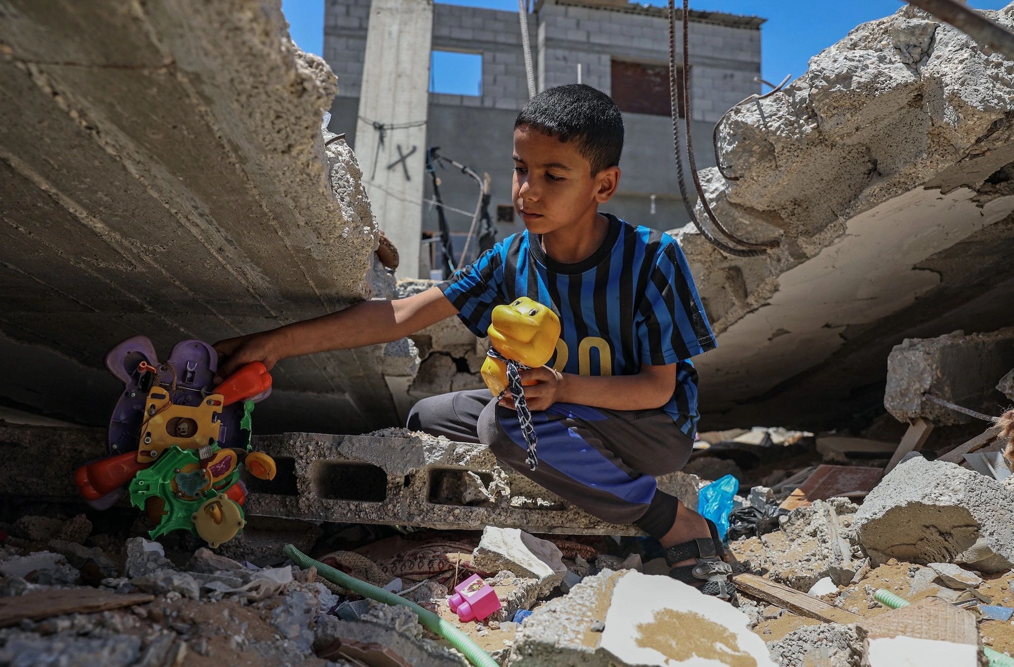 A child playing in the ruins in Gaza