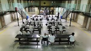 Inmates assembled in a prison
